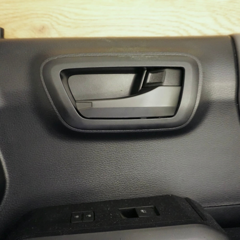 Door handle cover on a Tacoma interior door, side view