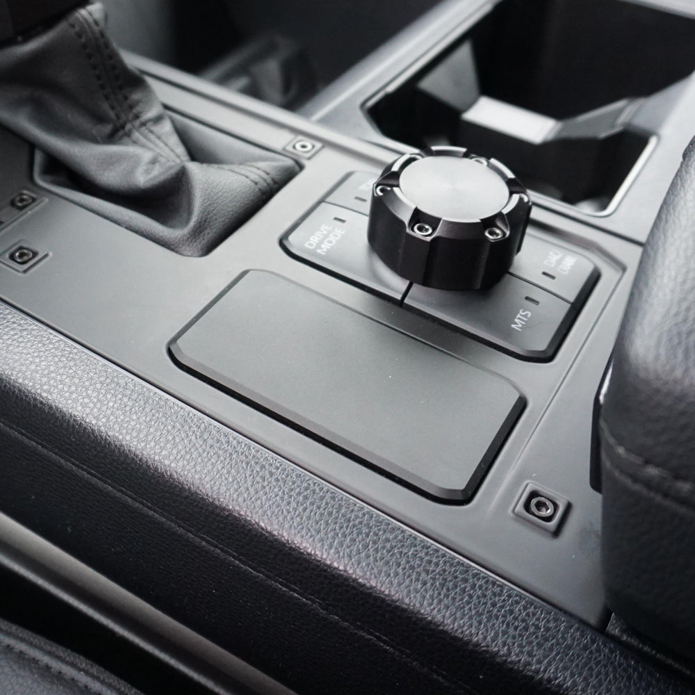 AJT Design 2WD Plate installed in the center console panel of a 2022+ Toyota Tundra