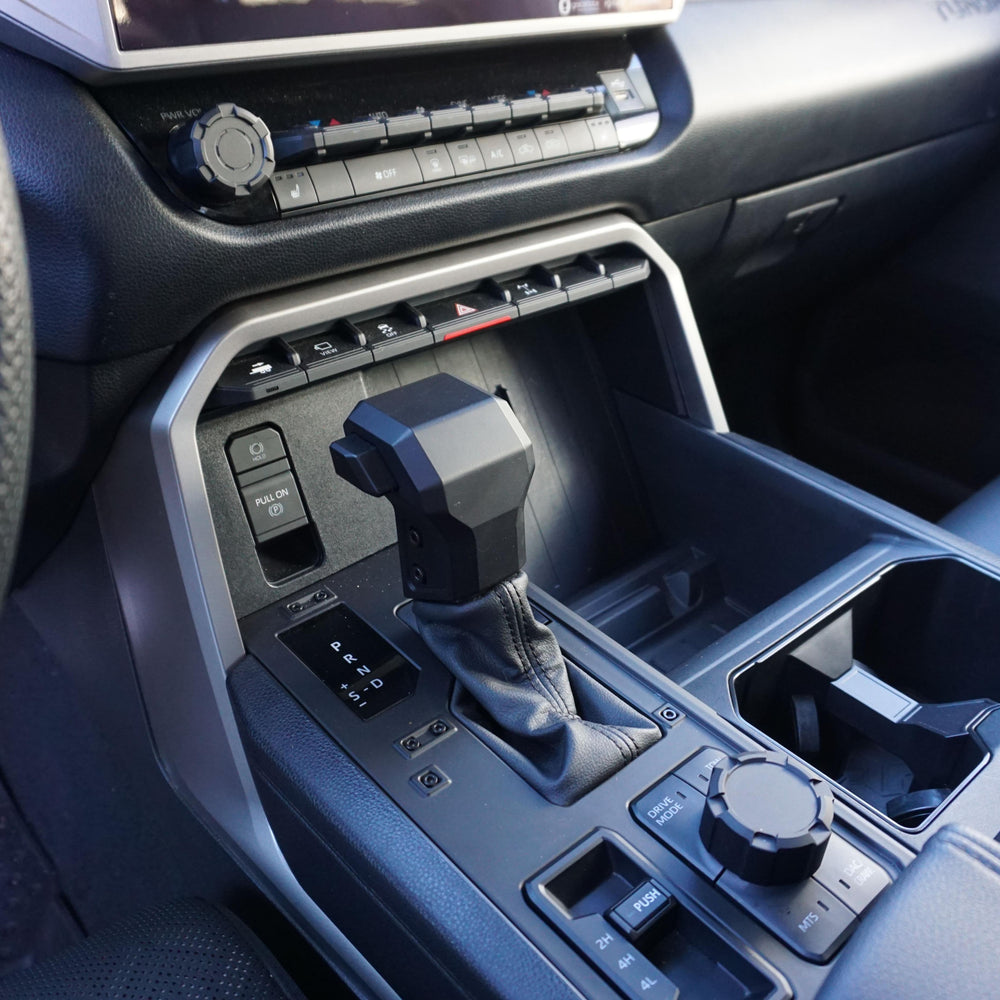 AJT Design V2 radio and drive mode knob set installed in a 2022+ Toyota Tundra