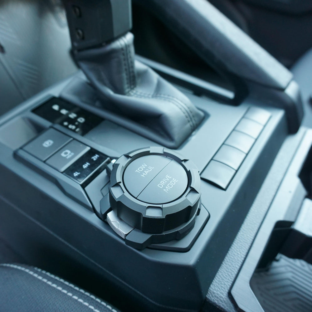 AJT Design V2 drive mode knob installed on the Toyota Tacoma center console