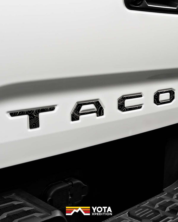thumbnail image 2 of Matte Black Emblem Overlay Kit For 2016-2024 Toyota Tacoma SR5 V6 – 5-Piece Set, Toyota OEM 2 of 6